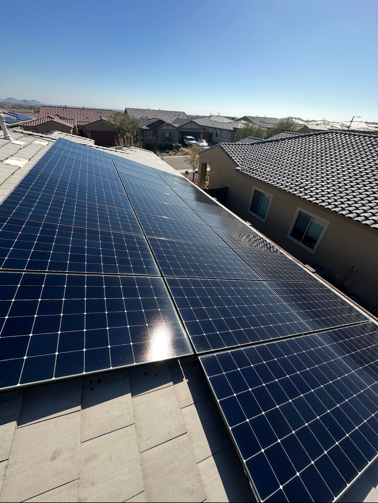 A clean roof-mounted solar array on a tile roof in the Phoenix area